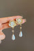 Flower-shaped pearl earrings